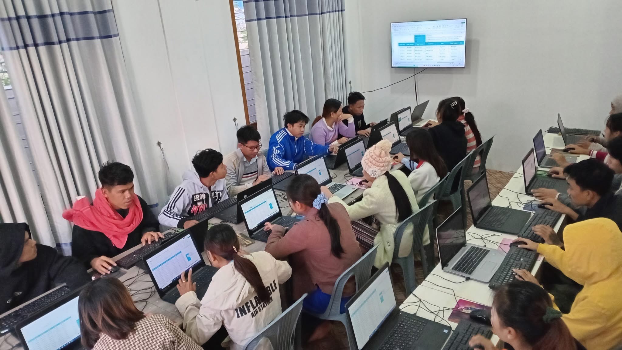 Students learning at Next Technology Services training session