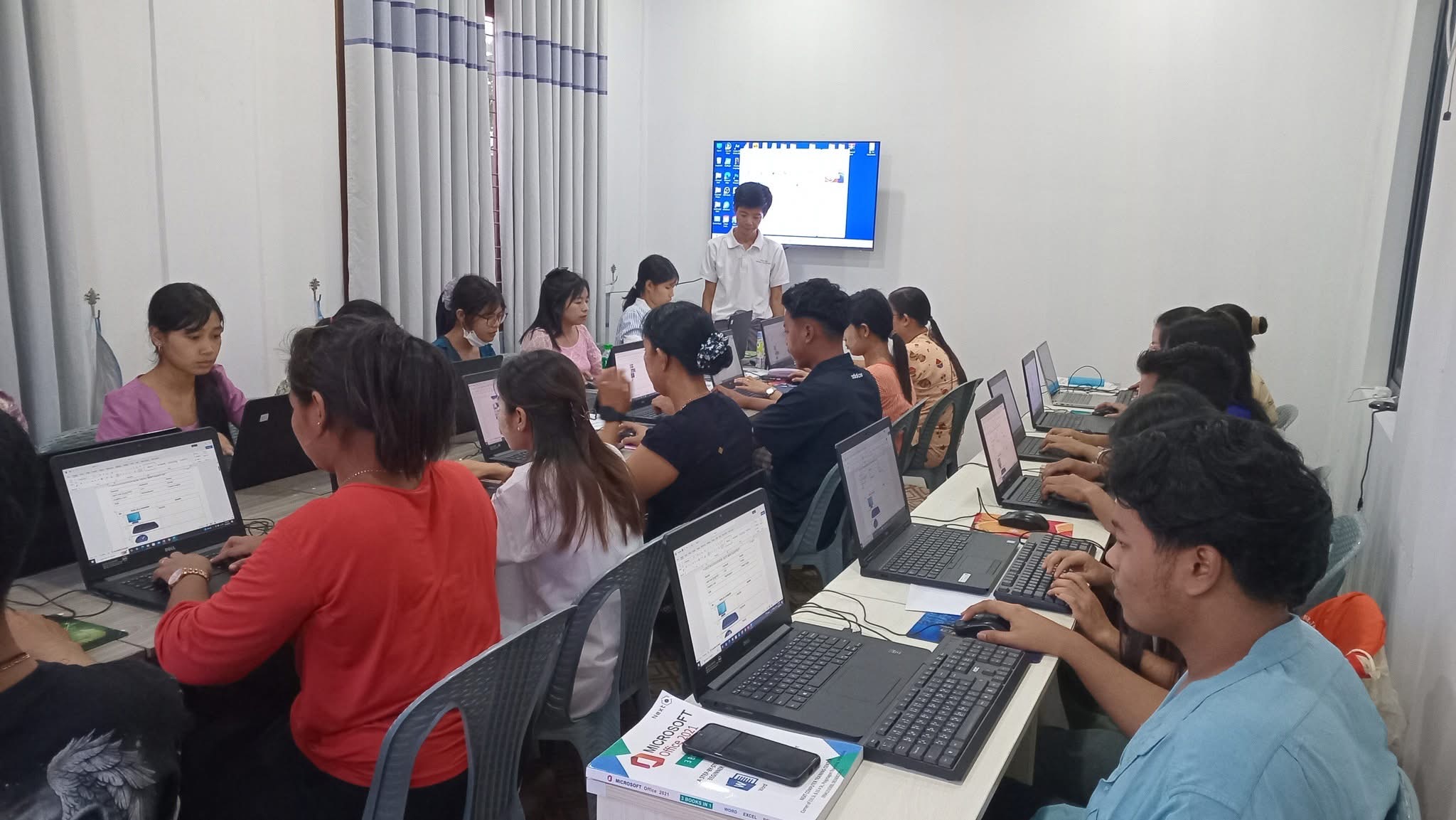 Students learning in an IT training workshop
